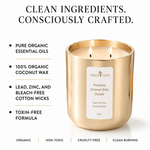 Load image into Gallery viewer, A gold candle jar with two lit wicks and a white front label reading Tabor Olive, shown on a white background with beneficial text about clean ingredients and organic coconut wax.