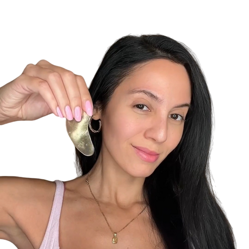 Picture of woman with a clean face holding an skincare eye mask