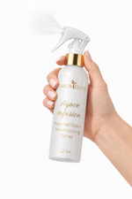Load image into Gallery viewer, Hand holding a bottle of 'Agave Infusion' natural odor neutralizing spray with a white background
