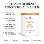 Load image into Gallery viewer, A white Tabor Olive premium coconut wax candle with a bamboo lid, shown on a white background with marketing text highlighting clean ingredients and certifications.
