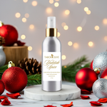 Load image into Gallery viewer, Bottle of Tabor Olive Yuletide Spice room spray with Christmas decorations in the background with soft lighting
