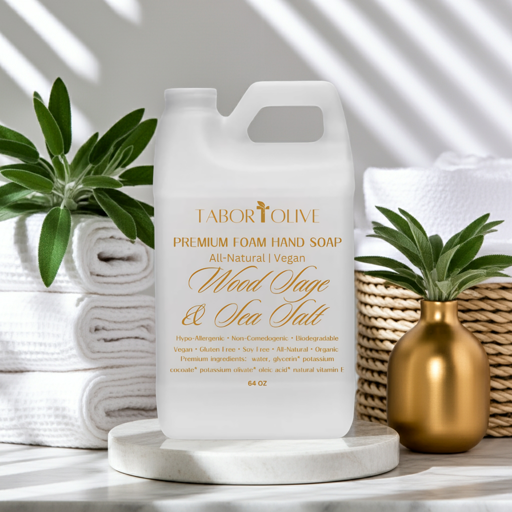 Tabor Olive premium foam hand soap bottle with towels and plants in the background