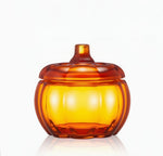 Load image into Gallery viewer, Amber glass pumpkin-shaped container on a white background

