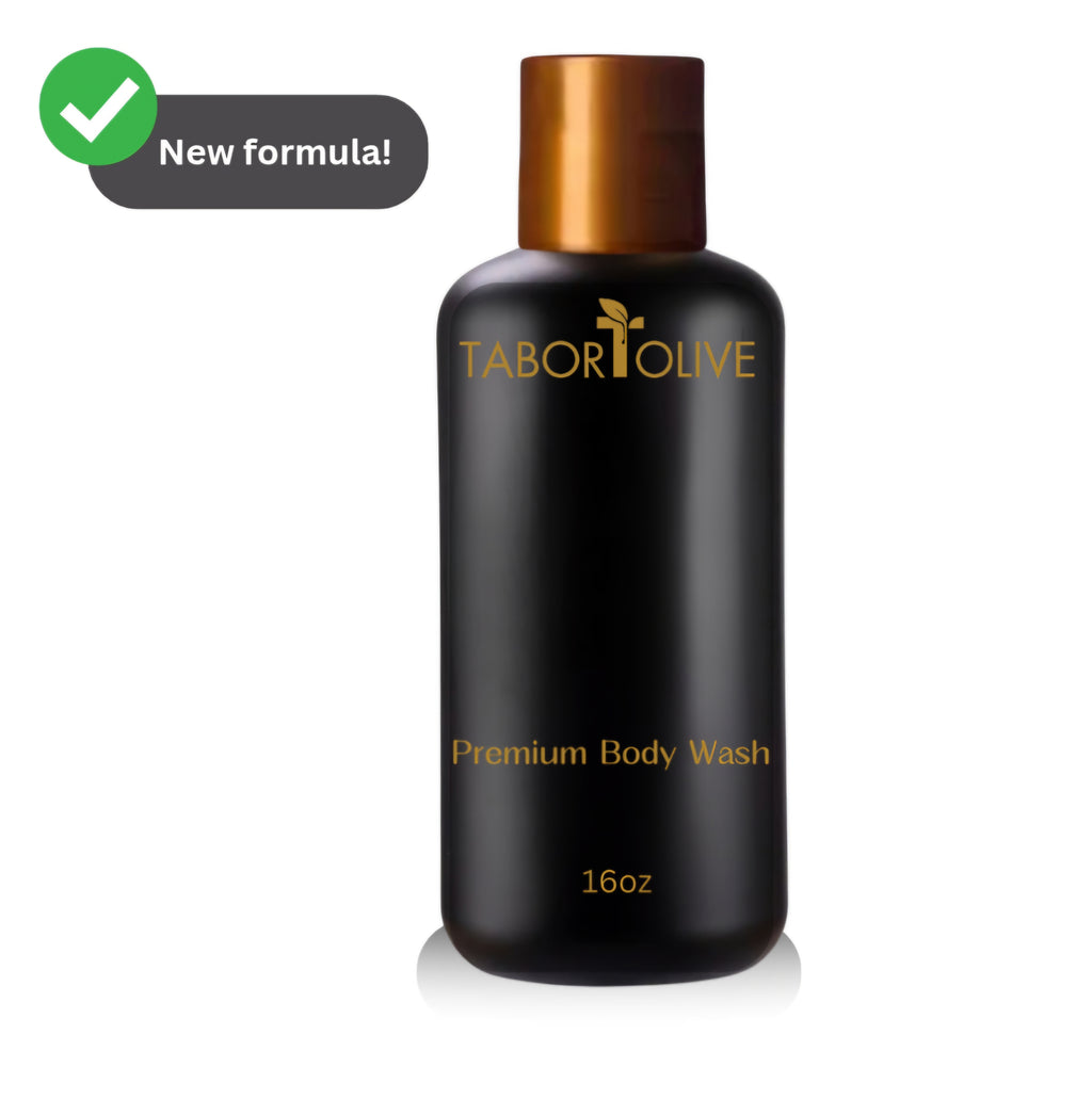 Black body wash bottle with gold cap and text on a white background