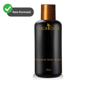Black body wash bottle with gold cap and text on a white background