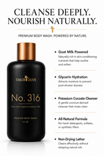 Load image into Gallery viewer, A black and bronze bottle of Tabor Olive No. 316 Premium Body Wash on a white background, flanked by text highlighting key ingredients and benefits such as goat milk power, glycerin hydration, and potassium cocoate cleanser.

