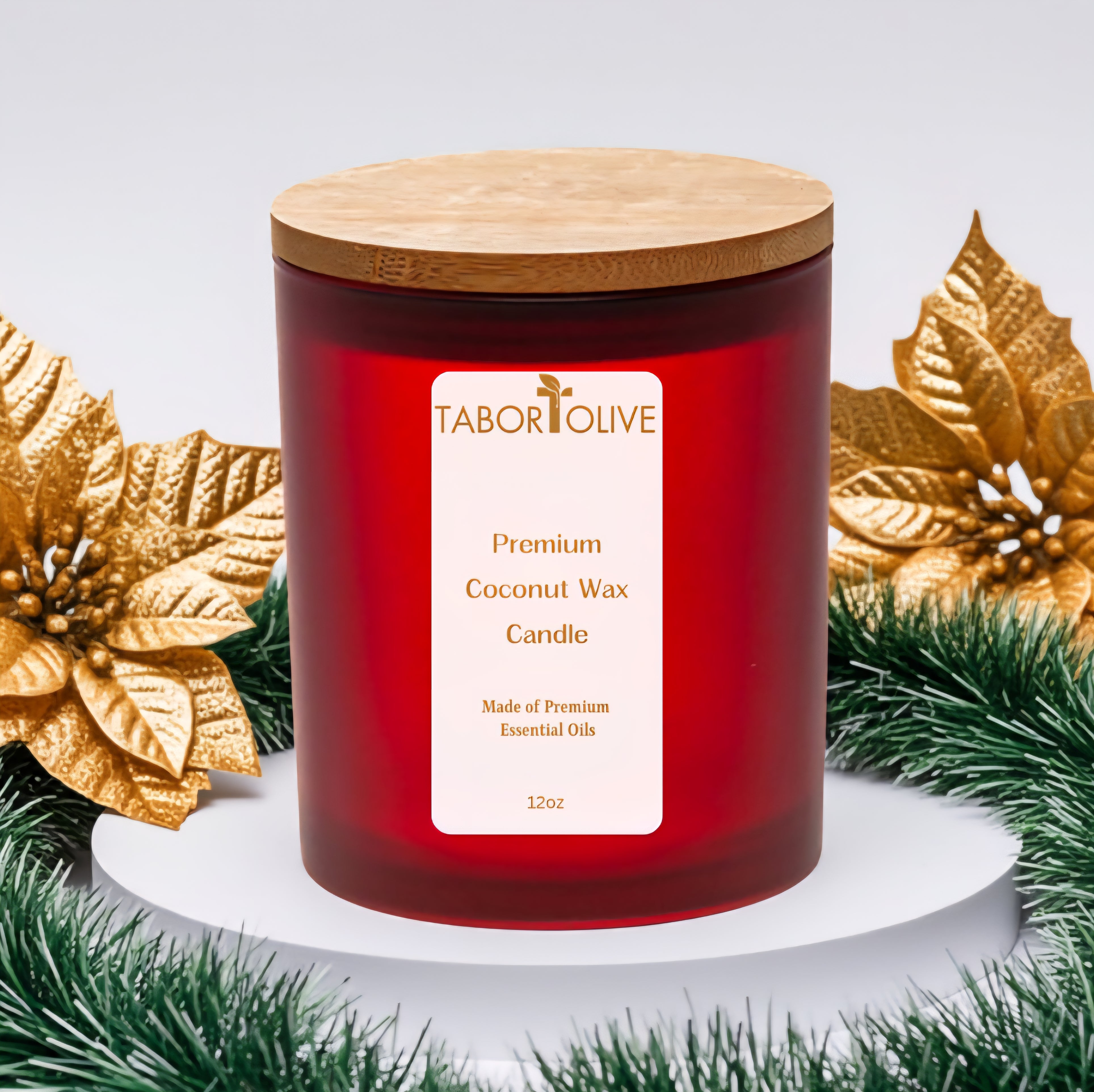 Red candle with a wooden lid on a white base, surrounded by festive gold leaves and green garland.